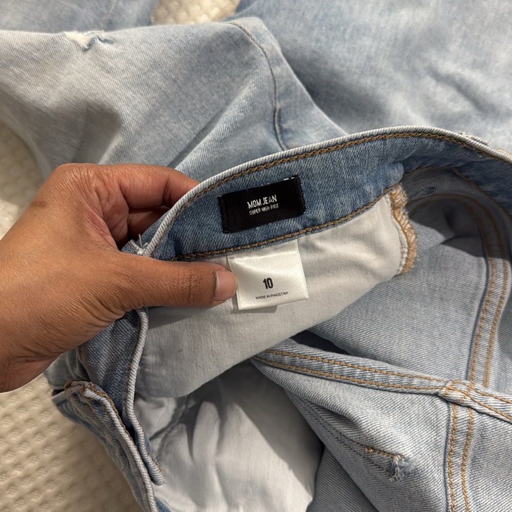 Express Super High Waisted Ripped Raw Hem Mom Jeans.  Size 10